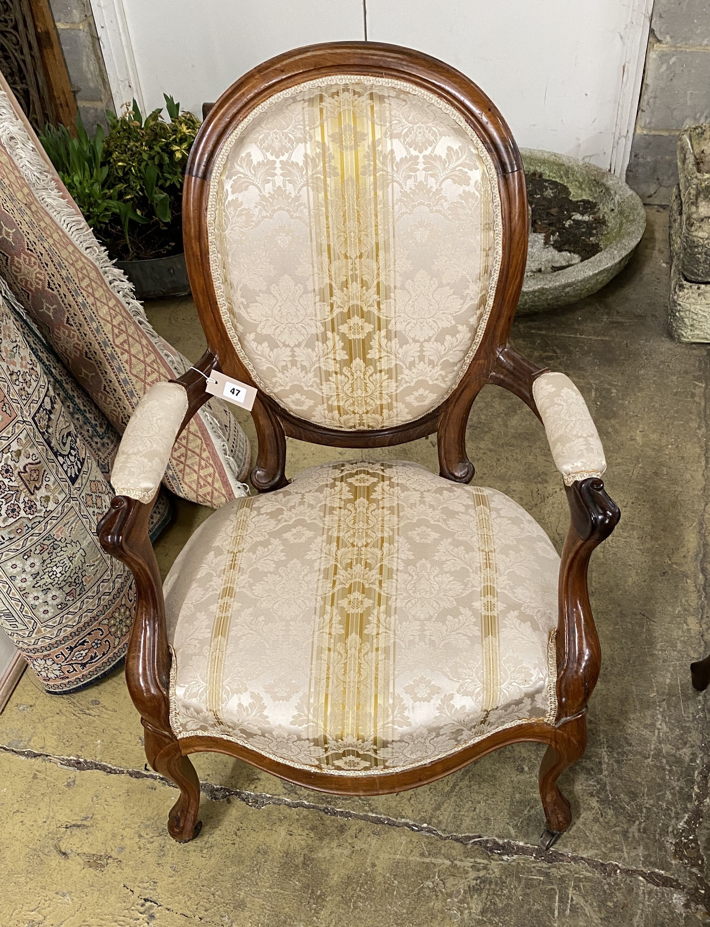 A 19th century French upholstered faded rosewood open armchair, width 62cm, depth 48cm, height 99cm